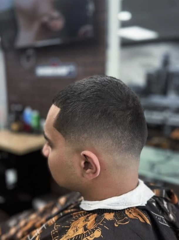 A fresh mid fade at OMI Barbershop in Livonia
