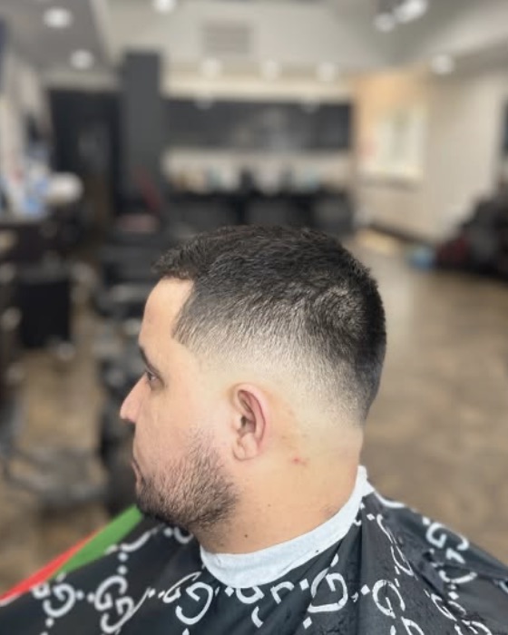 A clean skin fade inside OMI Barbershop on Six Mile Rd